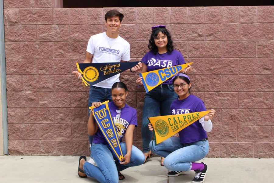 Seniors  pose with their respective college flags.