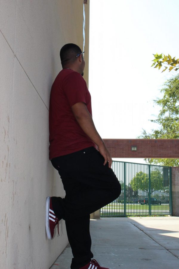 Senior Victor Andrade stands on the wall at Ridgeview High School. 