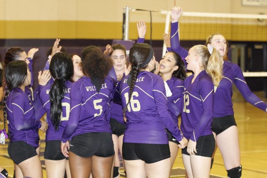 The Varsity girls volleyball team gets ready for their home game.