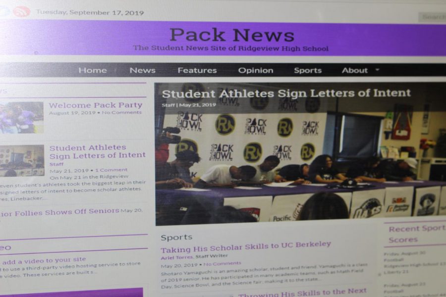 A computer screen shows the new Journalism website for Ridgeview High. 