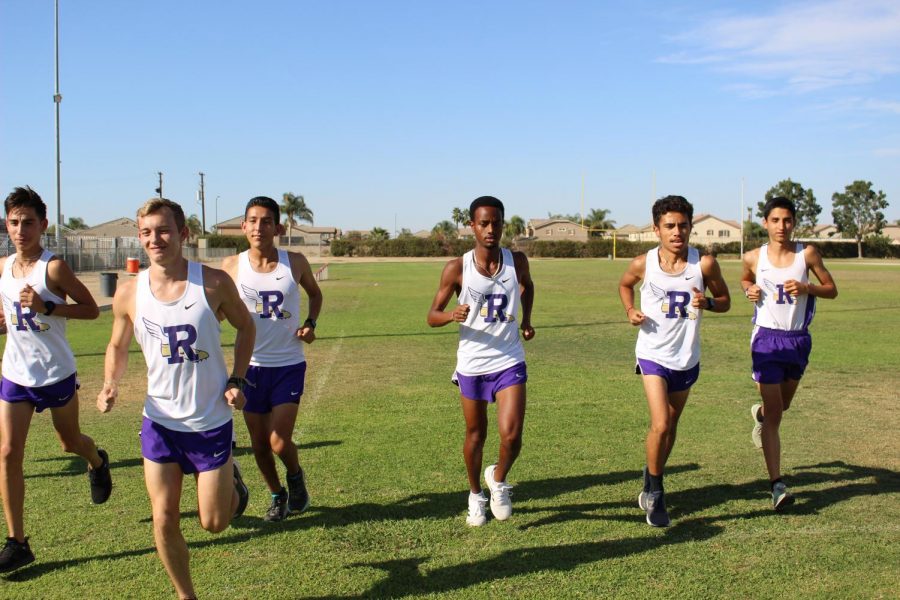 Returners+form+the+state+championship+cross+country+team+practice+at+Ridgeview.