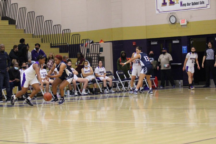 Girls Basketball Team playing against BHS Drillers