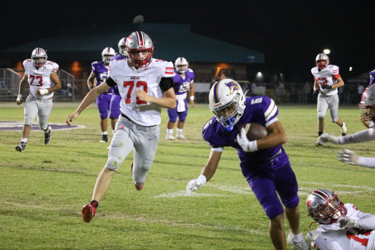 Damian Cortes running the ball down the field.