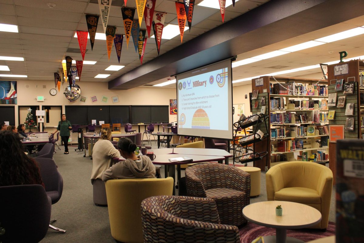 Ridgeviews counselors holding Parent University in the library. 