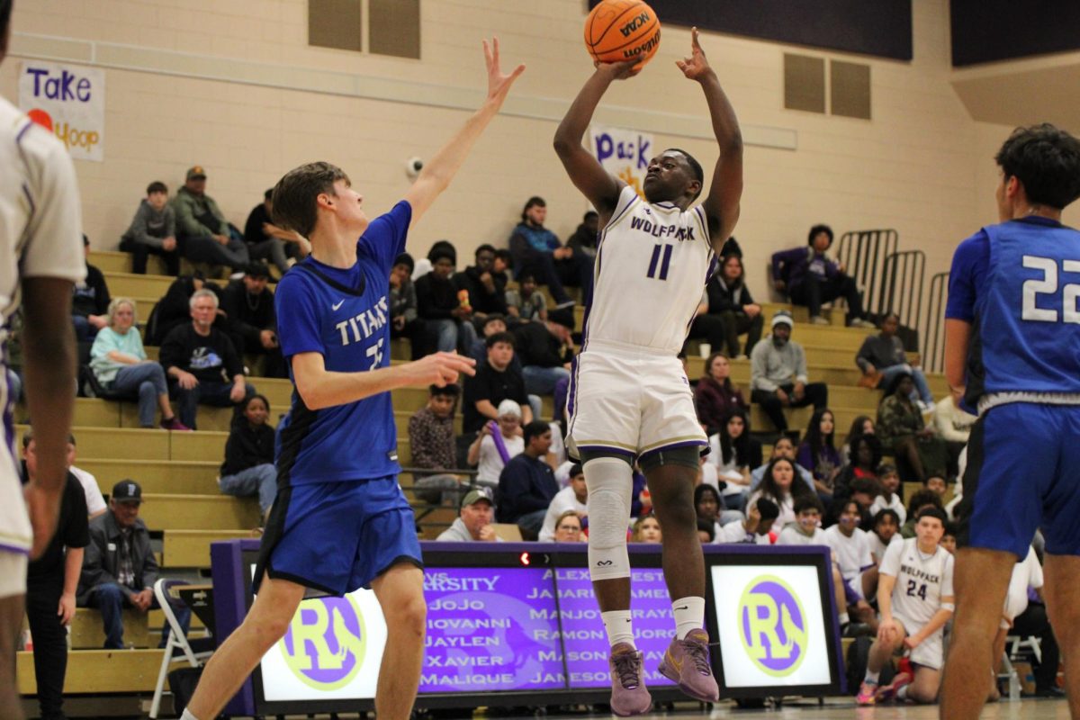 Malique White shooting the ball in a game against Frontier High School. 