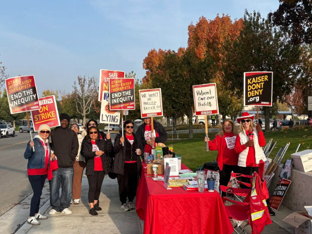 Several Kaiser workers outside protesting.