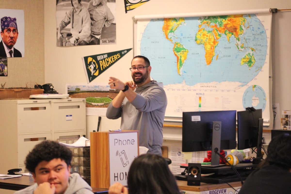 Teacher Elliott Hopkins teaching during his psychology/sociology class.