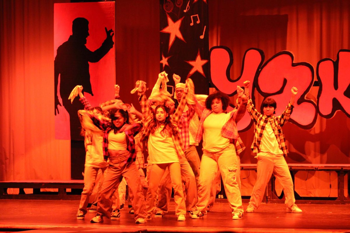 Students posing after their performance at the Dance Revue.