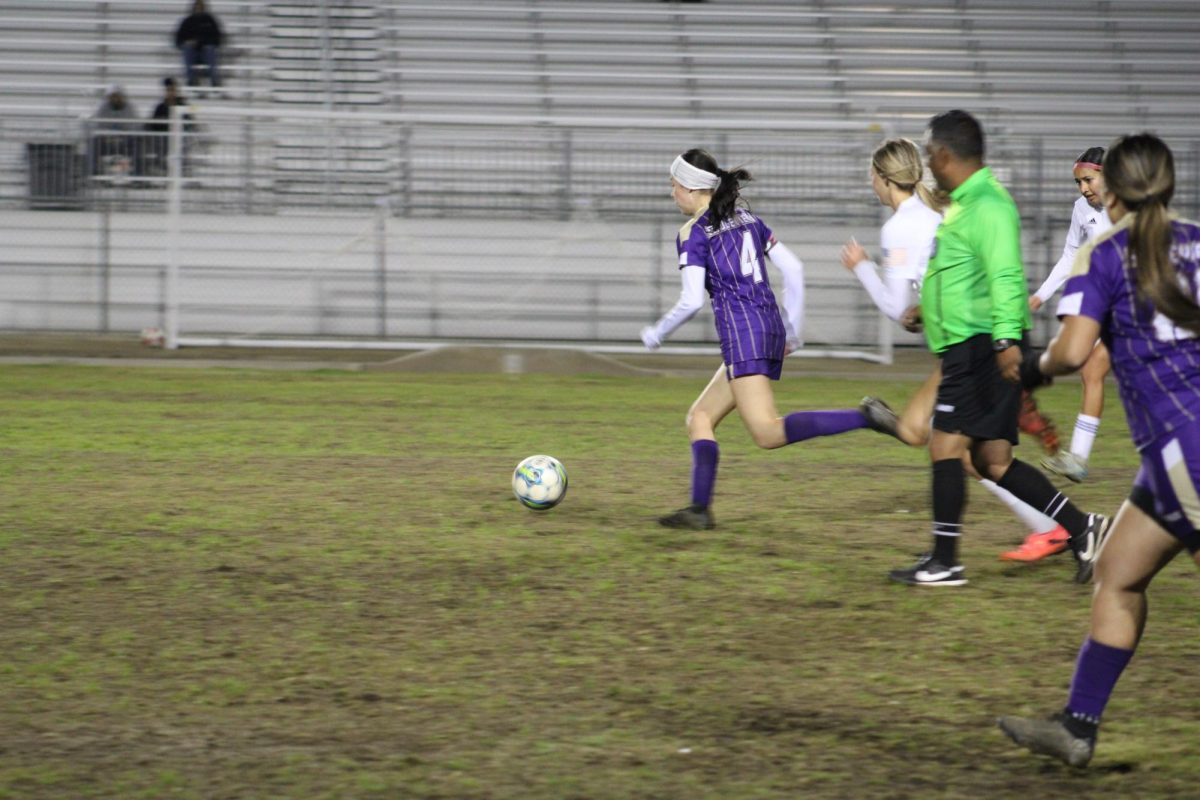 Chelsea Jauregui running past the forwards on the opposing team