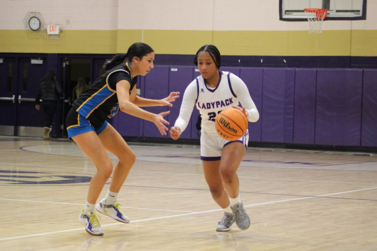 Akasia Jackson dribbling past Bakersfield Christain Highschool 