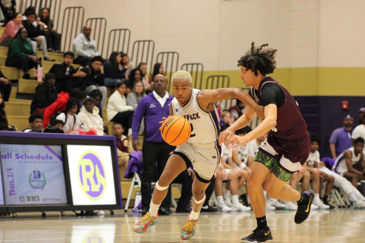 Amari Amey dribbling down the court against Independence 