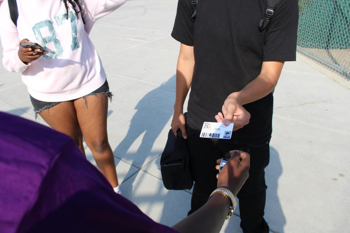 Ridgeview student showing ID to get into a football game.
