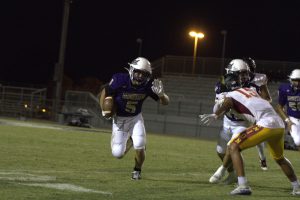 Gunner Cunningham running with the ball blocking people