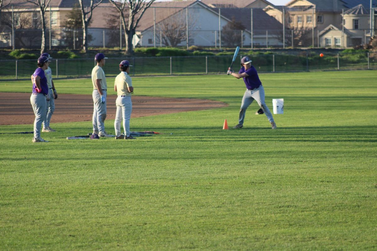 Alex Trujillo swinging the baseball bat at practice